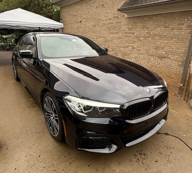 Black BMW M5 with deep paint gloss after a premium detail