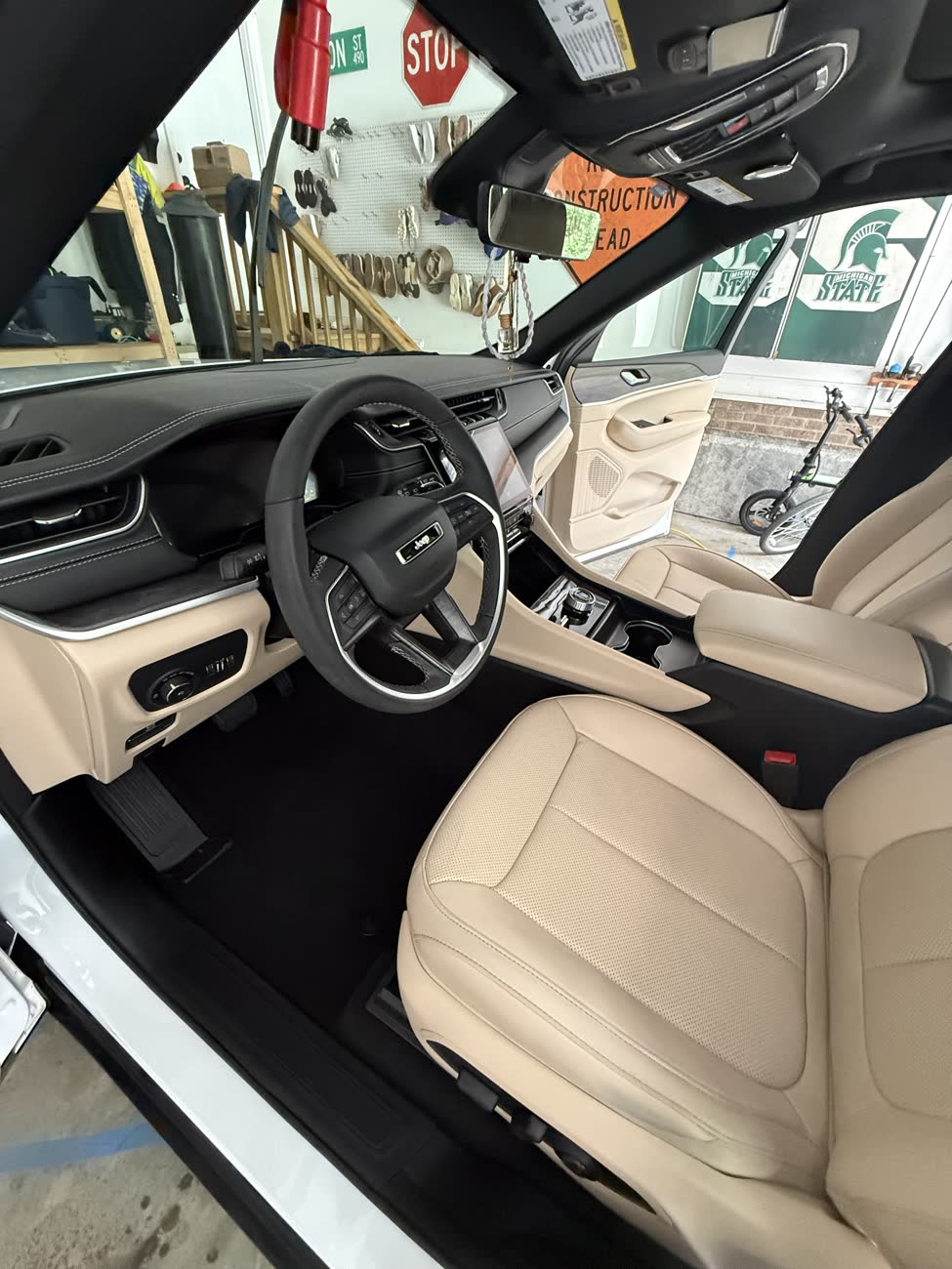 Jeep Grand Cherokee tan leather interior after a full interior detail