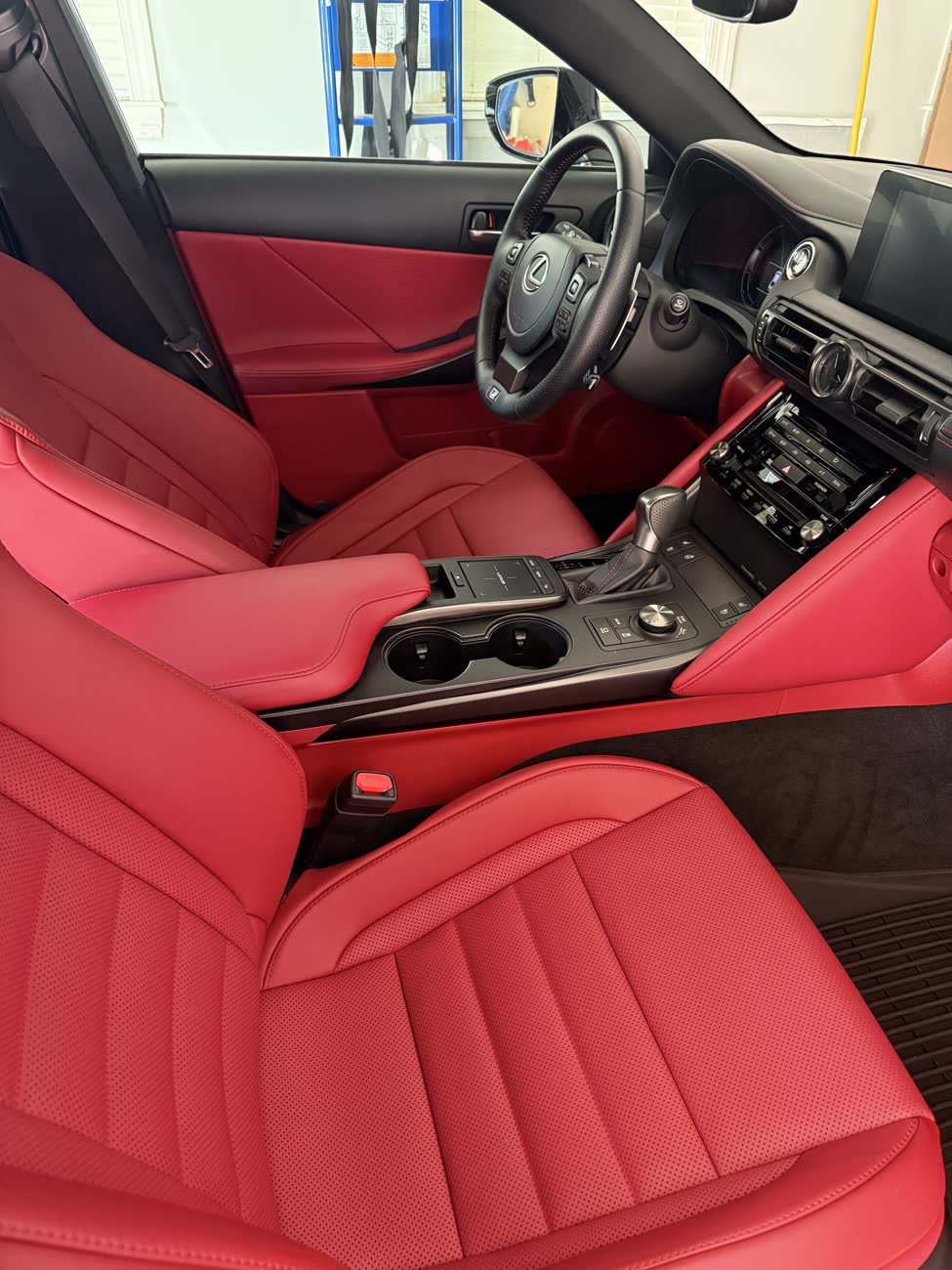 Lexus IS red leather interior after a full interior detail, clean console and dashboard